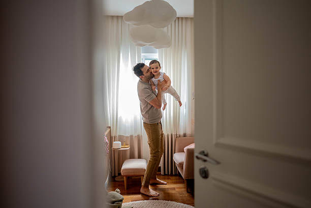istock Father playing with his daughter at home 2214674379