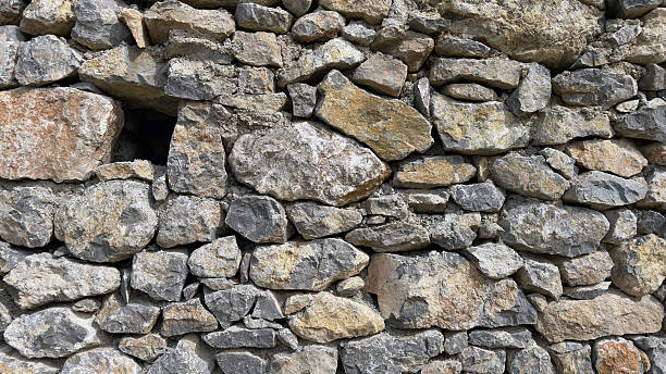 istock Natural stone wall made of large stones 2214674568