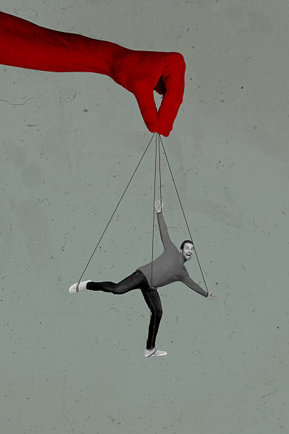 istock Trend artwork composite sketch image collage of huge hand red color skin devil arm hold rope manipulate puppet marionette toy man moving 2214680378