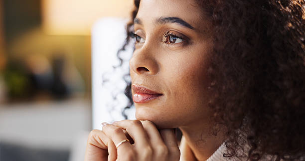 istock Thinking, vision and woman in home with reflection for mindset, inspiration and planning future. Idea, daydreaming and female person with thoughts for decision, remember memory and insight in house 2214681490