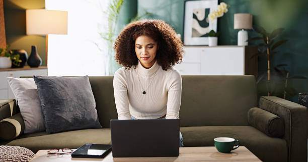 istock Sofa, woman and typing with laptop for remote work, editing information and content writer at home. Freelancer, female person and journalist with digital for interior newspaper, article or blog story 2214681512