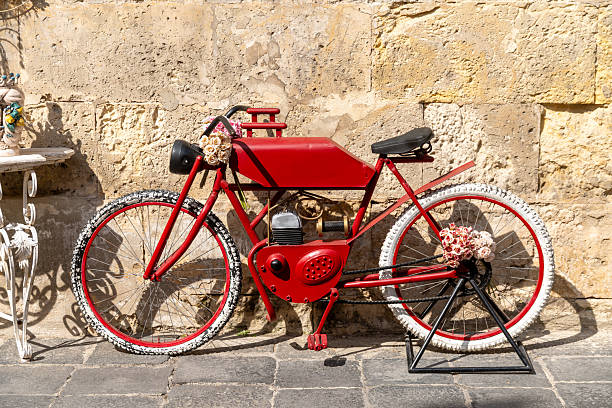 Historic narrow street with baroque building in Sicily, Italy, A bicycle on the background.