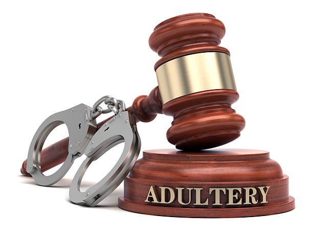 istock Adultery text on sound block & gavel 2214686519