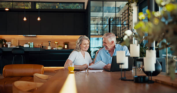 istock Planning, documents and laptop with old couple at home for social security benefits, annuity growth and retirement fund. Account balance, online banking and 401k withdrawal with people and profit 2214686873