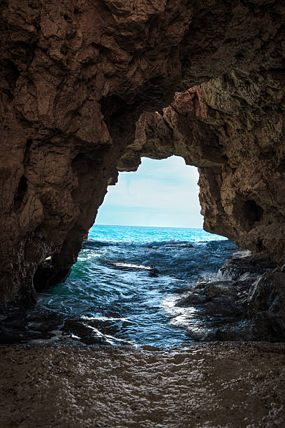 istock Cave with a door to the sea 2214689309