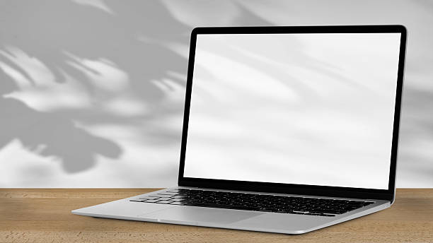 istock Tablet with  outdoors, trees swaying in the background. 2214690816