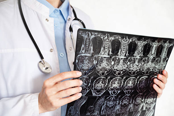 istock Doctor analyzing medical imaging for patient diagnosis in a clinical setting 2214691631
