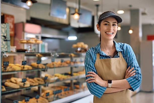 istock Successful female bakery owner looking at camera. 2214696823