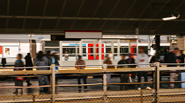 A train in blurred motion in a railroad station