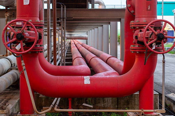 istock Red industrial fire fighting piping system with valves. 2214697926