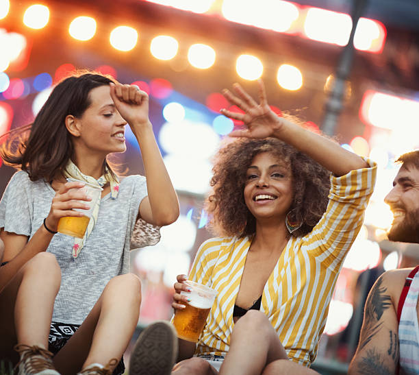 istock Group of friends chilling before a concert. 2214698054