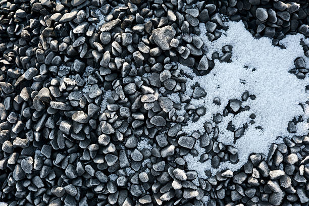 Dark stones are beautifully contrasted by delicate layers of frost.