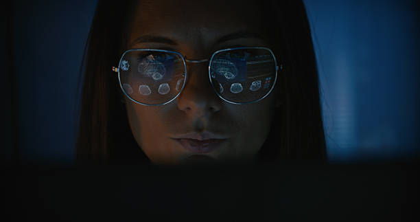 istock Female scientist working on a computer. Results of a human MRI brain scan displayed on the computer screen reflecting in glasses. Medical science research. Medical science research 2214701697