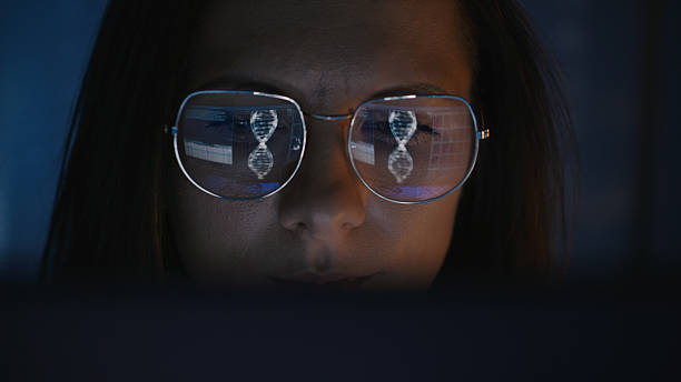 istock Female scientist working on a computer. Results of a human DNA string research on the computer screen reflecting in eyeglasses. Medical science research 2214702681
