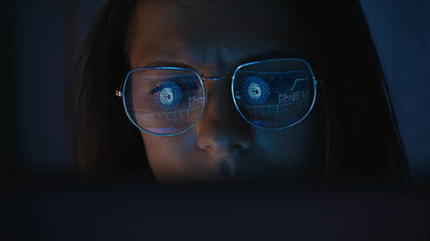 istock Female scientist working on a computer. Results of a virus research on the computer screen reflecting in eyeglasses. Medical science research 2214702684
