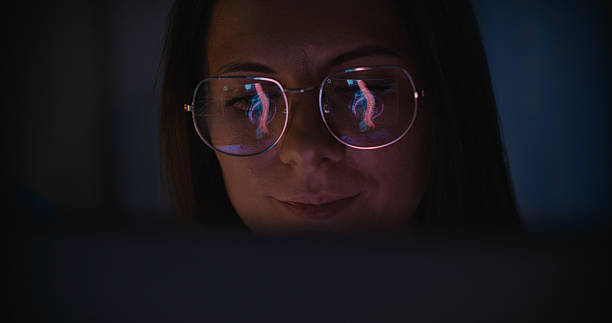 istock Female scientist working on a computer. 3D model showing inflammation in the spine on the computer screen reflecting in eyeglasses. Medical science research 2214702849