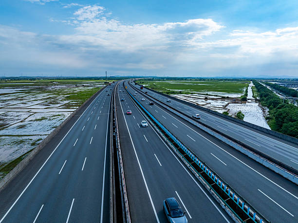 istock Cars driving on the highway 2214704314