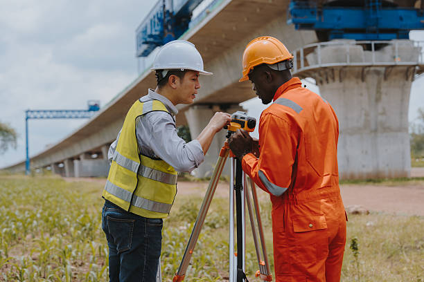 istock Surveying engineers take measurements using surveying cameras at road and high-speed railway construction sites or conduct safety inspections. 2214712165