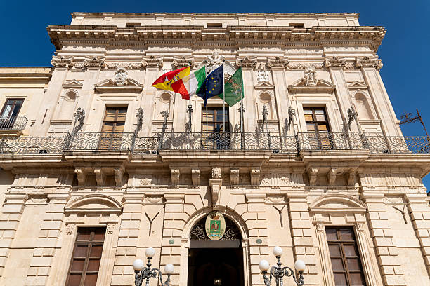 istock Historic Palazzo Civico with Flags Syrakus Sicily 2214712579