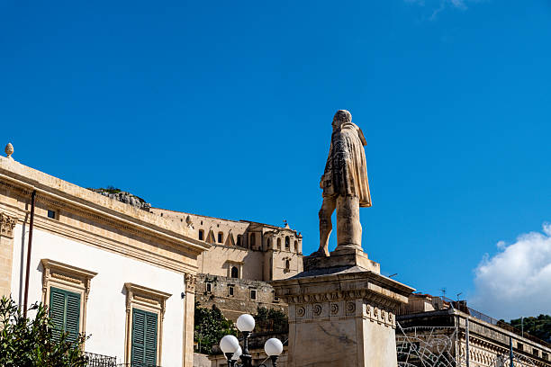 istock Statue and historic buildings in Scicli 2214712580