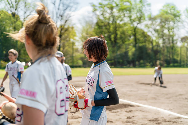 istock Female Softball Team Practicing Together in a Tokyo Suburb Field 2214715231