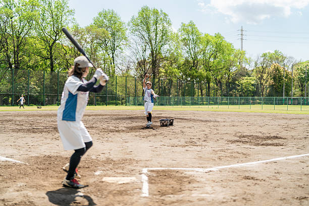 istock Women Softball Team Practicing Together on a Sunny Day in Tokyo 2214715266