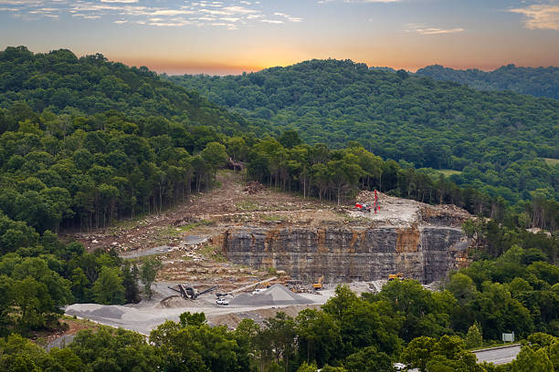 Industrial gravel quarry. Open pit mining site of limestone materials extraction for construction industry.