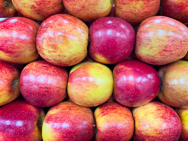 Close up photo of fresh apples in a supermarket grocery stalls.