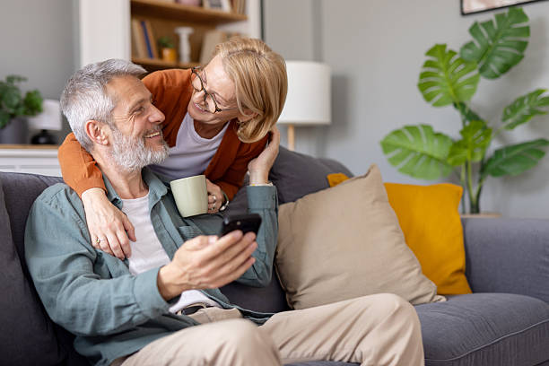 istock Couple smiling together in a warm and inviting setting 2214717028