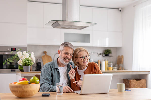 istock Joyful Seniors Sharing a Fun Moment in Bright Kitchen 2214717051