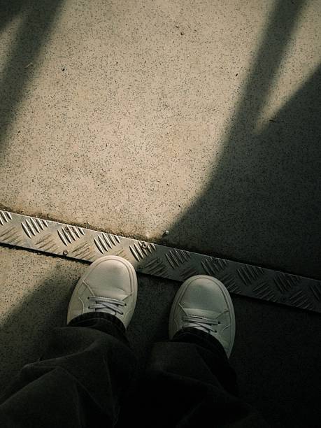 istock white sneakers on the floor background 2214720841