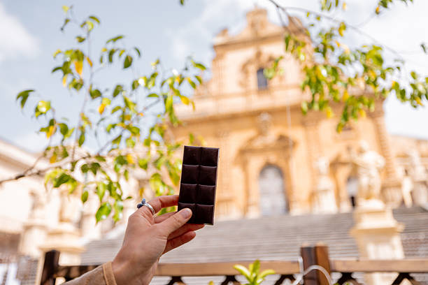 Modica chocolate bar in front of Sicilian baroque cathedral stock photo