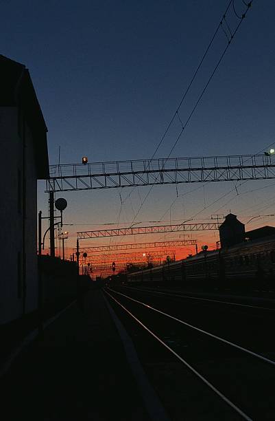 istock sunset at the train station, burning sky 2214722854