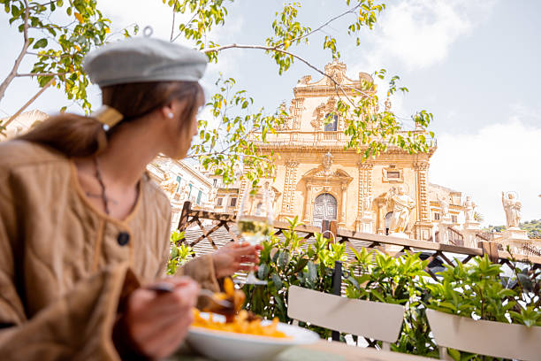istock Sicilian pasta alla Norma with cathedral view 2214723663