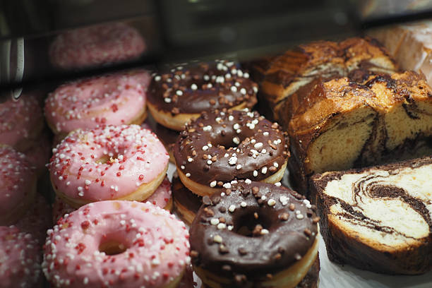 istock chocolate donuts display for sale at local store 2214724471