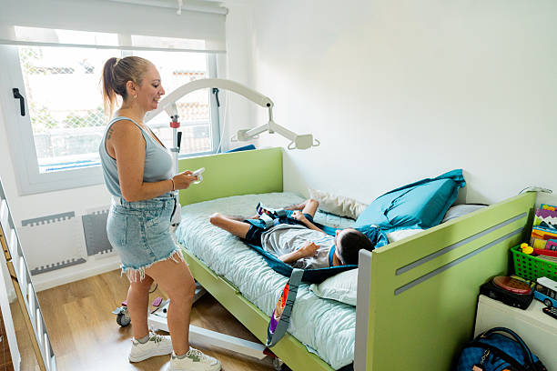 istock Mother helping son with mental illness on bed at home 2214725122