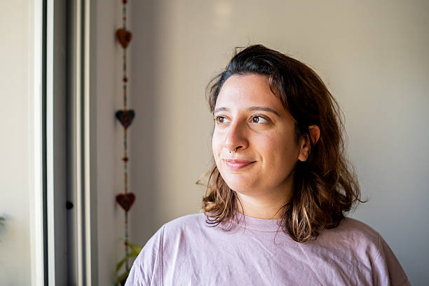 istock Young woman contemplating at home 2214725290