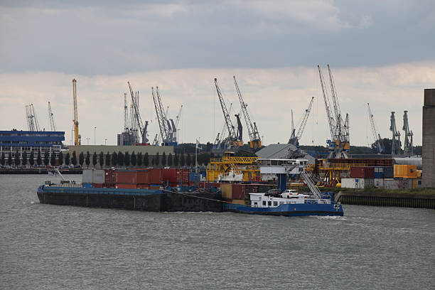 istock Cargo container ship at a container terminal in Rotterdam port, Netherlands 2214726188