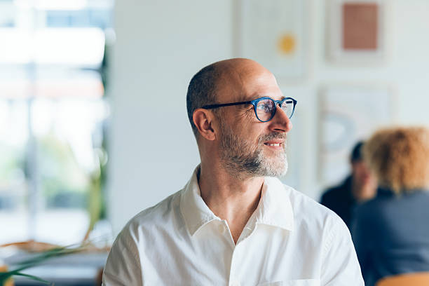 istock Smiling Mature Man Sitting in a Bright Relaxing Interior Setting 2214727202