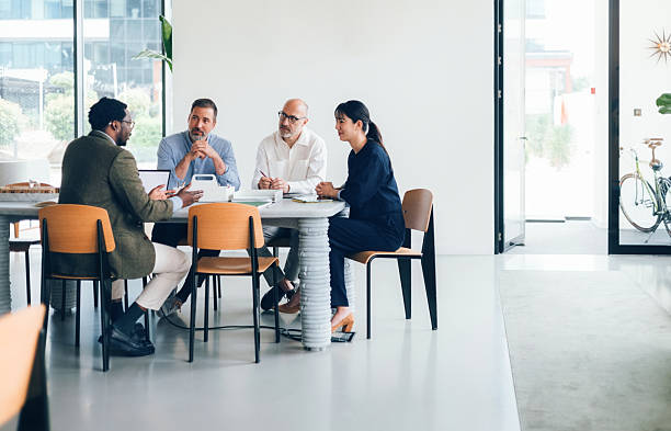 istock Diverse Team Collaborating in Modern Office During Business Meeting 2214727209