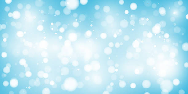 istock Abstract blue bokeh background with soft glow and glittering sparkles. Festive, dreamy, and elegant, perfect for holiday, birthday, or celebration themes. Vector illustration. 2214729411