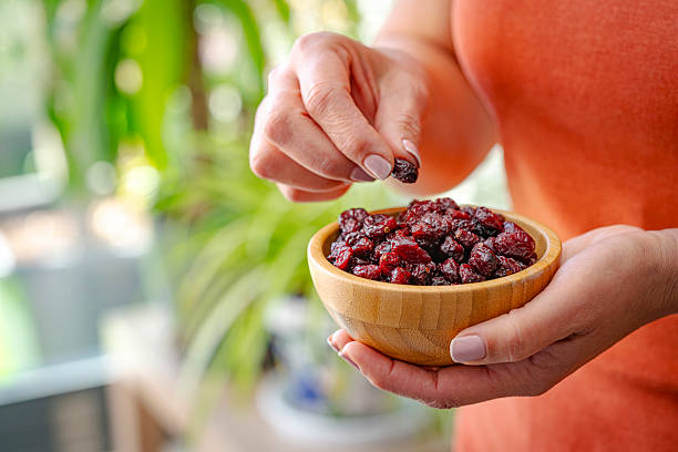 Woman eating organic dried berries