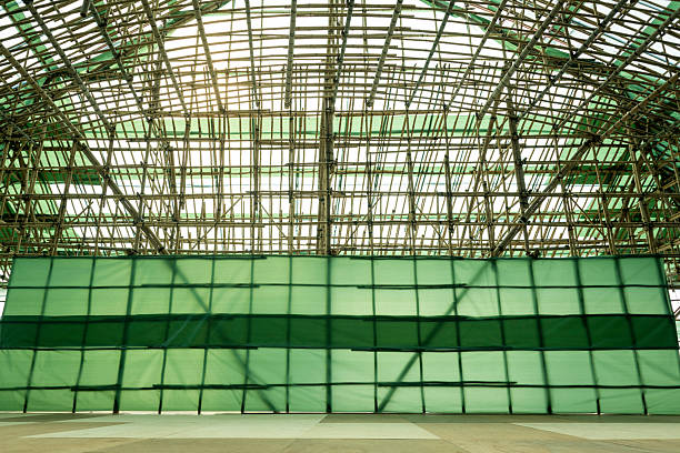 A temporary stage built with bamboo poles and wooden boards