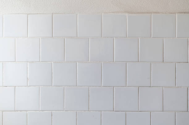 istock White ceramic tiles covering a wall creating a textured background 2214738172