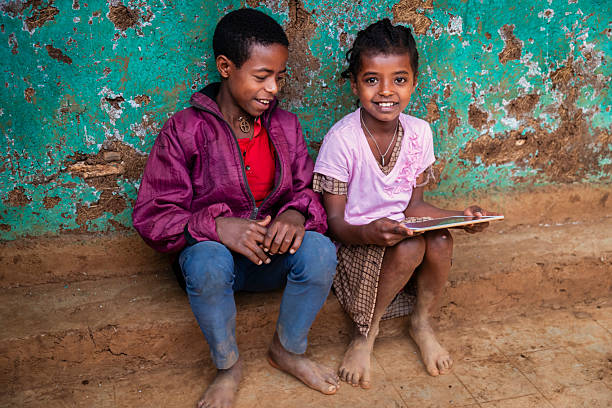 istock African children using digital tablet, East Africa 2214739250