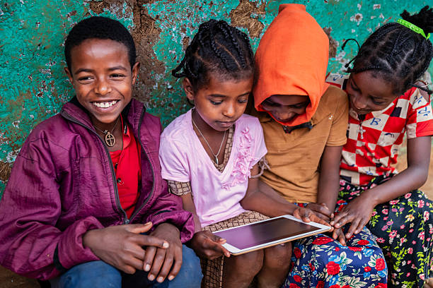 istock African children using digital tablet, East Africa 2214739297