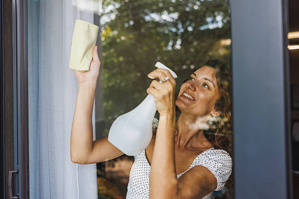 istock Woman Washing Window 2214740740