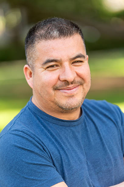 istock Smiling hispanic mature man posing looking at the camera 2214743764