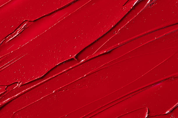 istock Rich red lipstick texture with smooth application and glossy finish, showcasing vibrant color and luxurious feel for beauty and cosmetic themes. 2214747231