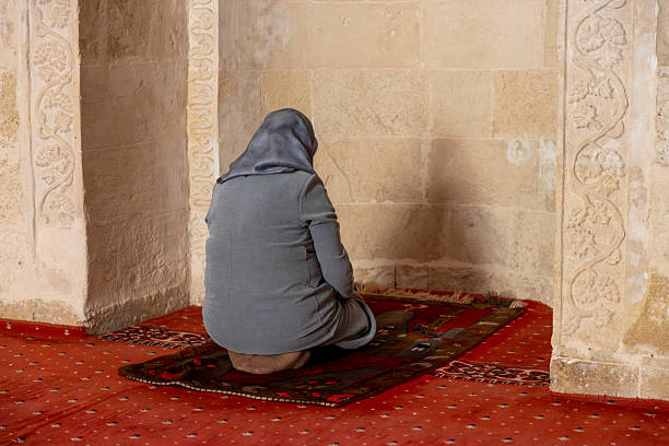 A woman praying in a mosque